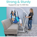 A woman smiles while seated in a blue sling on a Vive Health Bariatric Hydraulic Patient Lift as another woman operates it beside a gray couch. The text reads, Strong & Sturdy Supports Up To 400 lbs. Ideal for seamless patient care with its reliable hydraulic pump system.