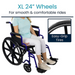 A person in a light blue shirt and white pants sits in the Vive Health Heavy Duty Bariatric Transport Wheelchair, which has dual heavy-duty 24-inch wheels and a robust steel frame to support up to 400 lbs for smooth rides. Text: XL 24” Wheels for smooth & comfortable rides.