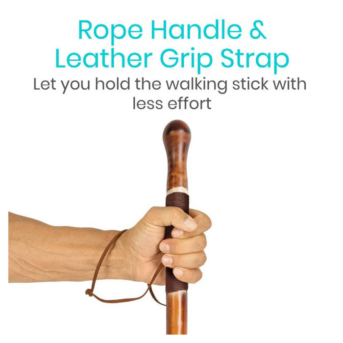 A hand holding the Vive Health Carved Wooden Walking Stick with a willow bark design and a leather grip strap, featuring text that reads, Rope Handle & Leather Grip Strap let you hold the walking stick with less effort.