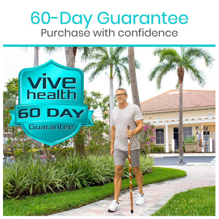 An older man strolls down a paved path holding a Vive Health Carved Wooden Walking Stick, its willow bark design adding elegance amidst the palm trees and greenery. A house is in the background, featuring a large emblem stating 60-Day Guarantee above Purchase with confidence.