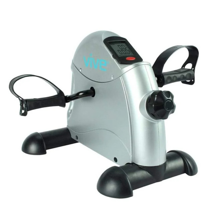 The Vive Health Portable Pedal Exerciser is a silver, under-desk mini exercise bike with black accents, featuring a digital display, tension knob, and pedals. Its perfect for low-impact workouts to boost circulation and stamina.