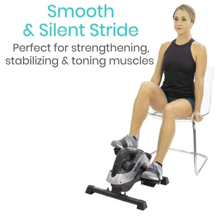 A woman in athletic gear sits on a clear chair using a compact VIVE Health Smart Magnetic Pedal Exerciser under-desk elliptical for her legs. The text reads, Smooth & Silent Stride. Perfect for strengthening, stabilizing & toning muscles.