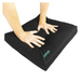 Pressing down on the Vive Health Wheelchair Gel Seat Cushion reveals its softness and pressure resistance, offering tailbone pain relief. The cushion features a premium foam layer with a small white and teal Vive logo on one side.