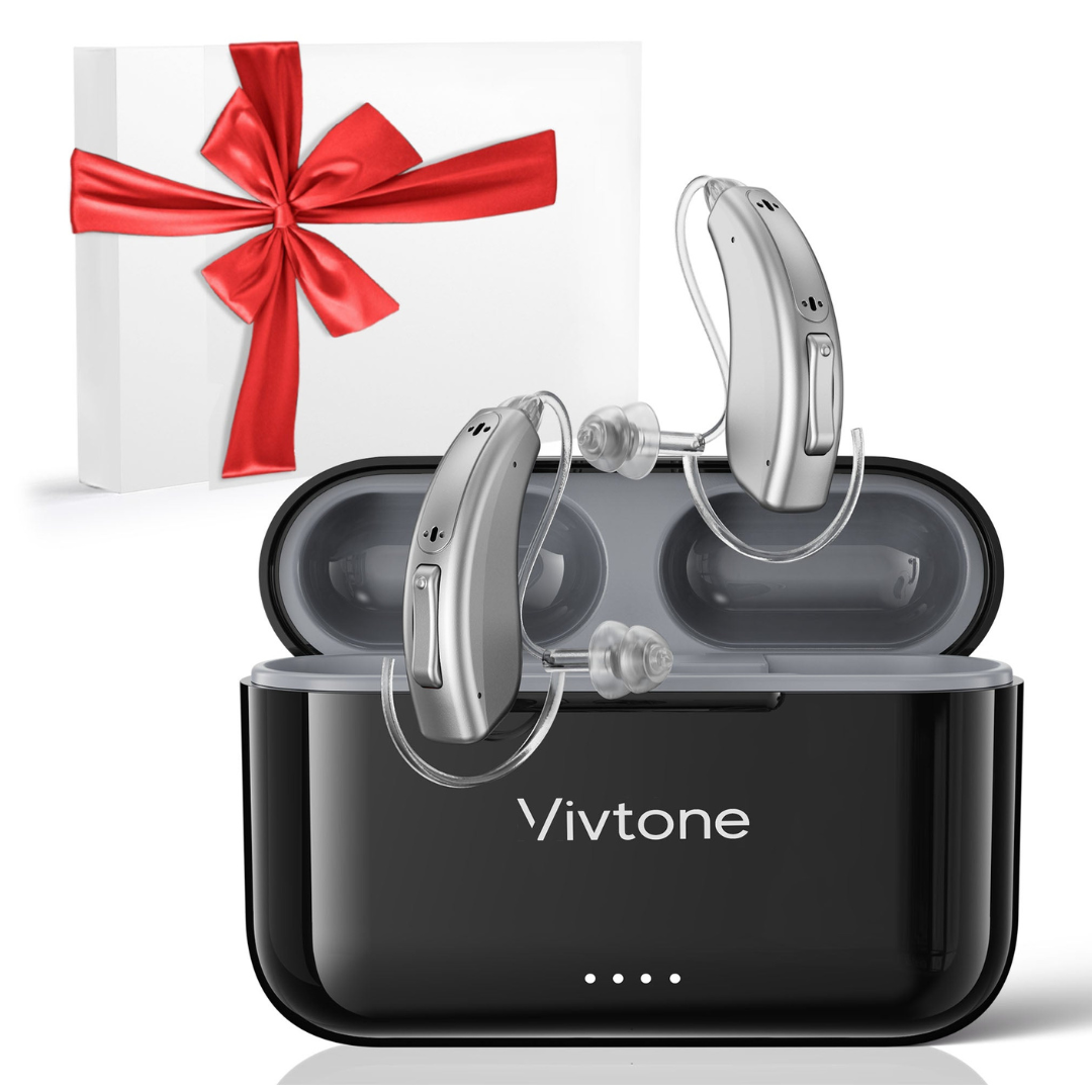 A pair of Vivtone Lucid508 Over-The-Ear Hearing Aids sits in an open black charging case labeled Vivtone, with a white gift box tied with a red ribbon in the background.