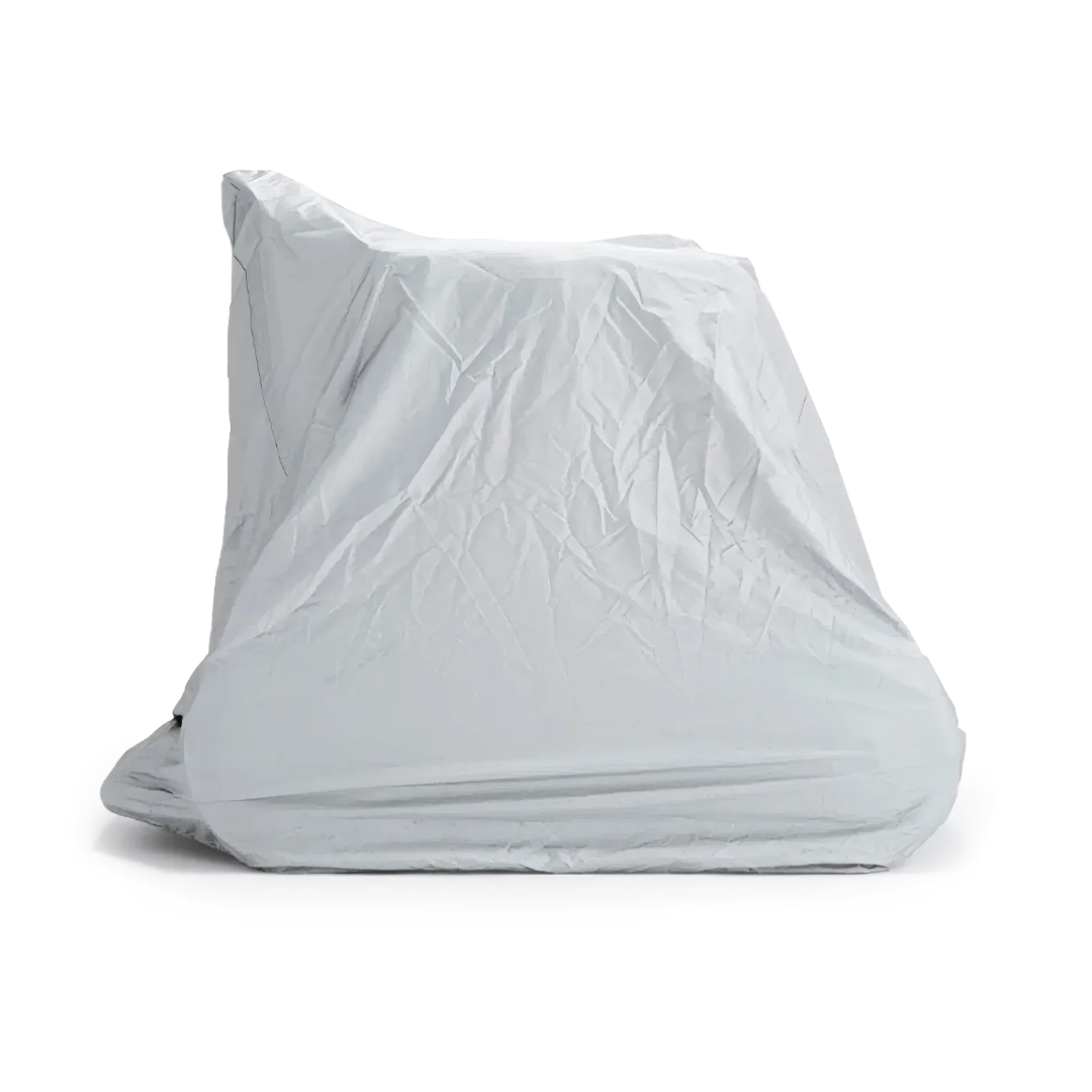 A WHILL Model F Powerchair is protected by a light gray Waterproof Cover For Whill Model F Powerchair, forming a sleek, angular silhouette against a white background.