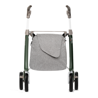 A front view of a green ByAcre Carbon Fiber Rollator with four black wheels and gray handles, featuring a light gray Weekend Bag attached to the front with a flap closure and thoughtful table design features.