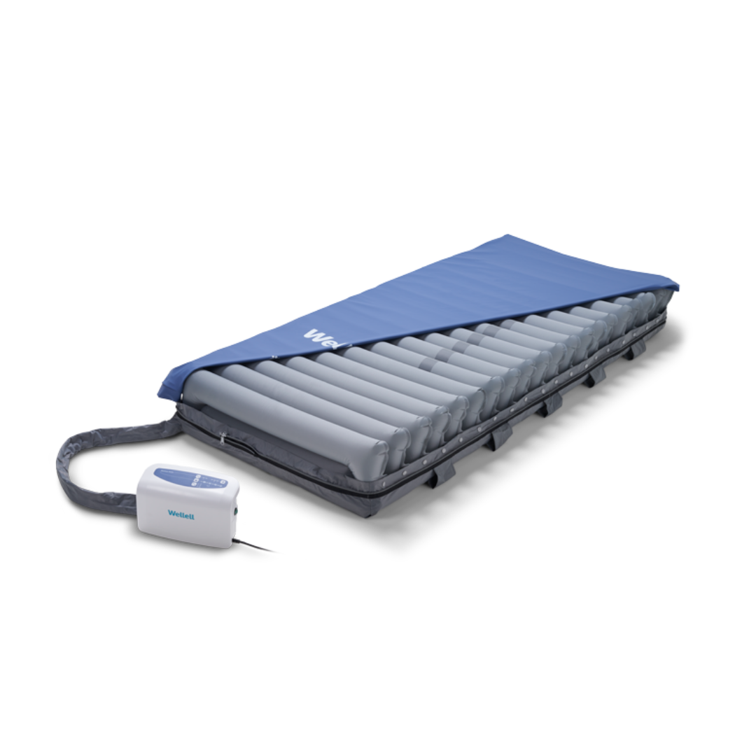 The Wellell Domus Auto G2 Bariatric Alternating Pressure and Low Air Loss System, with a blue cover and built-in pump, is designed for medical or home use to help prevent pressure ulcers.