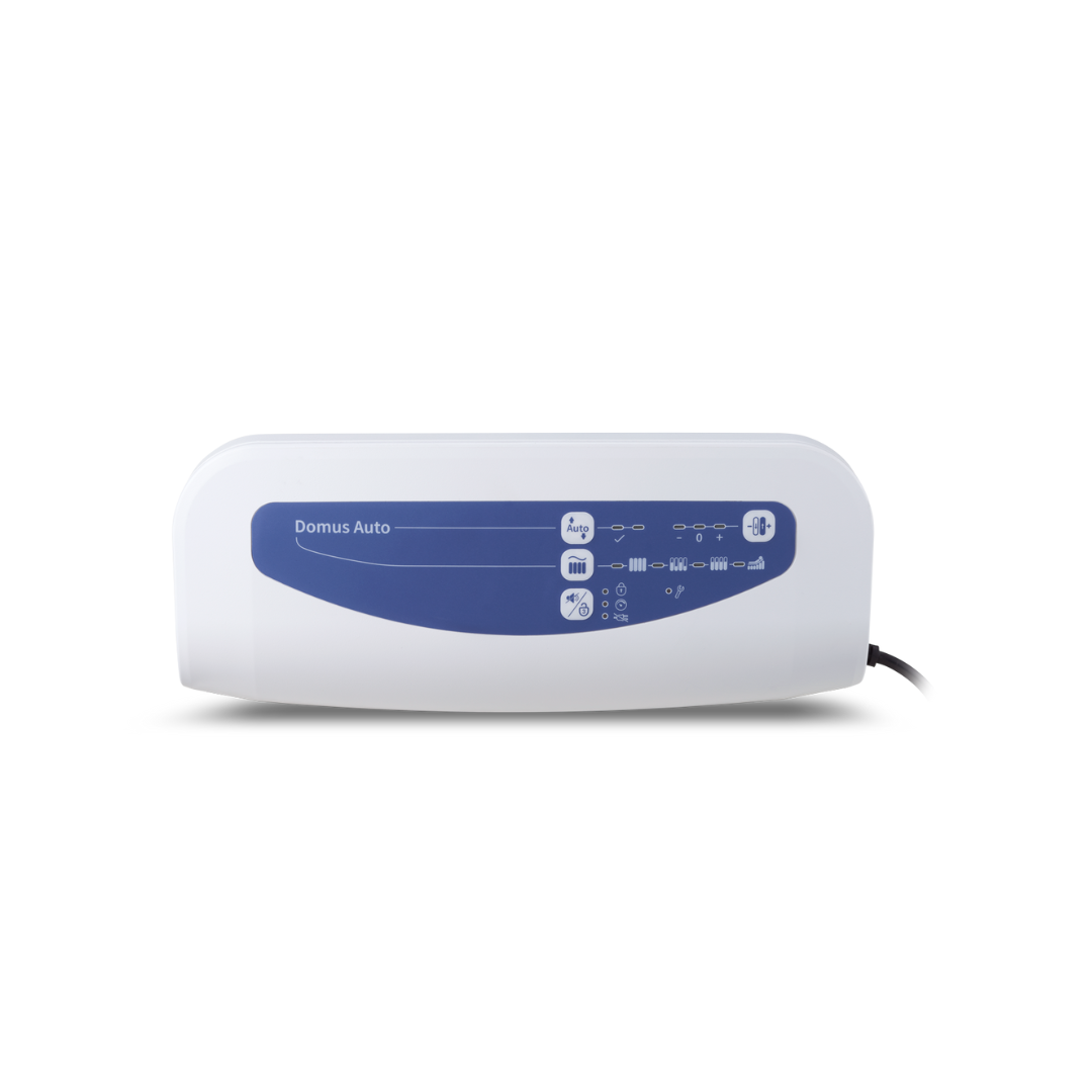 The Wellell Domus Auto G2 Bariatric Alternating Pressure and Low Air Loss System is a white rectangular medical device with a blue control panel, various buttons and icons, and a power cord on the right side, shown against a plain white background.