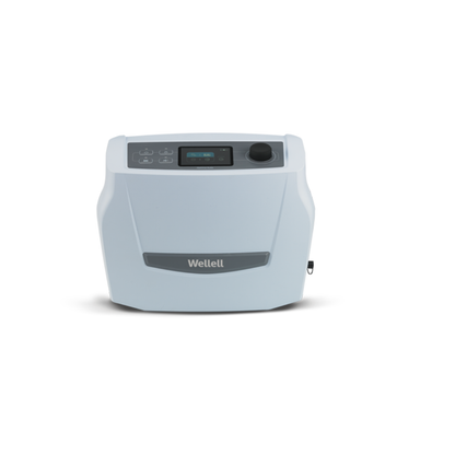 The Wellell Optima Auto Alternating Pressure and LAL System is a compact, light gray medical device with a small screen, buttons, and dial on the front top—ideal for use with alternating pressure mattresses and automatic pressure adjustment.