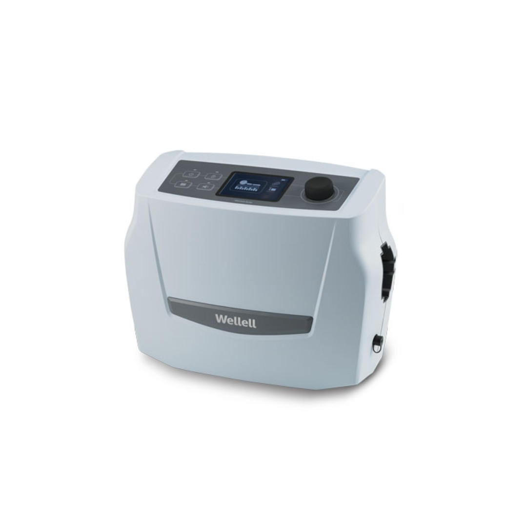The Wellell Optima Auto Alternating Pressure and LAL System is a compact, light gray medical device with a digital display, buttons, and top dial. It features automatic pressure adjustment for enhanced patient comfort and care.