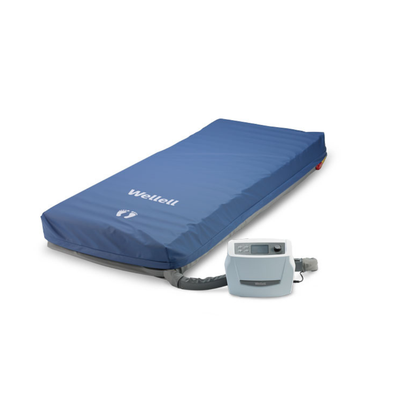 The Wellell Optima Auto Alternating Pressure and LAL System is a blue medical mattress with automatic pressure adjustment and a connected control pump, designed for patient support and pressure relief, displayed on a white background.