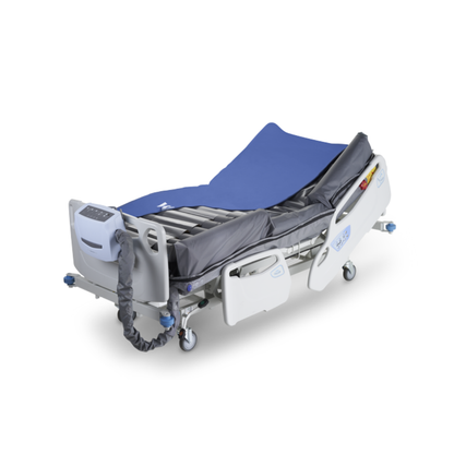 The Wellell Optima Turn Automated Lateral Rotational Pressure Relief System is a modern hospital bed with a blue mattress, adjustable side rails, electronic controls, wheels, and lateral rotation therapy for pressure injury prevention.