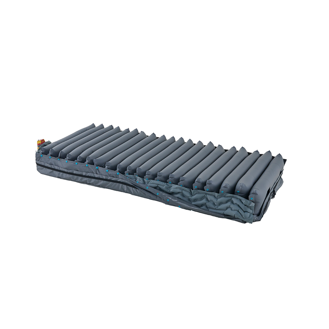A fully inflated Wellell Procare Auto G3 Hospital Air Mattress System in gray, featuring horizontal ridges and displayed flat against a white background, exemplifies the superior quality characteristic of advanced hospital air mattress systems.