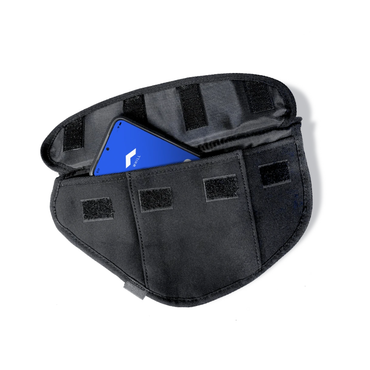 The Side Bag for Whill C2 & F Model Power Chairs is a black fabric pouch with Velcro closures, shown open with a blue device inside—ideal for convenient storage as a mobility accessory or wheelchair armrest bag.