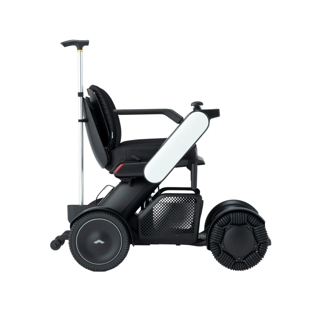 The Cane Holder for the WHILL Model C2 Power Chair is a convenient accessory that attaches easily, adding practical support and extra mobility to your sleek, modern wheelchair design.