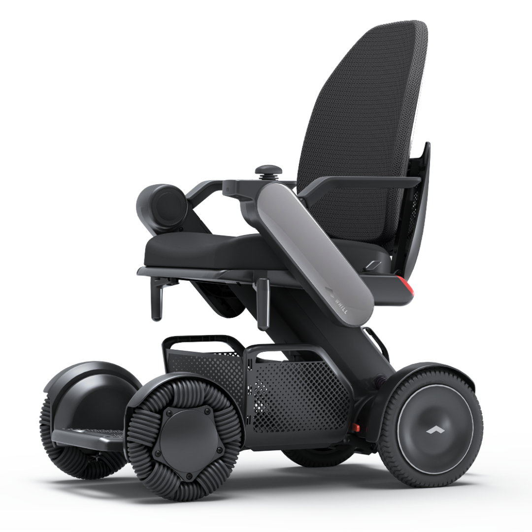 The Whill Model C2 High Back Smart Power Chair features a mesh backrest, padded seat, armrests, and four large omni wheels for superior mobility. Remote app control enhances convenience for this advanced electric wheelchair.