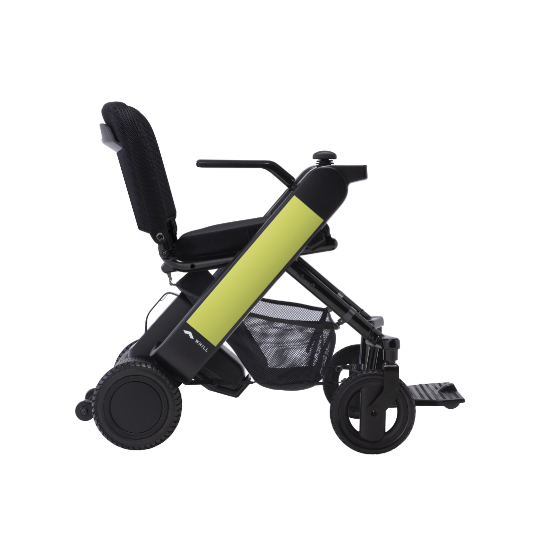 The Whill Model F Lightweight Portable Electric Wheelchair features a black frame with yellow side panels, armrests, padded seat and backrest, footrest, large rear wheels, portable folding design, and comes with warranty details.