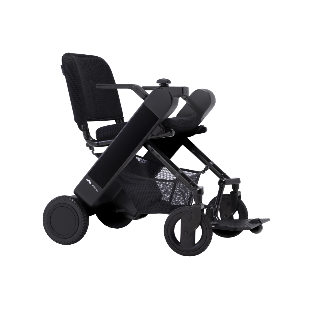 The Whill Model F Lightweight Portable Electric Wheelchair features a modern black design, mesh seat, wide armrests, large rear wheels, and small front wheels. See full specs and warranty details in the downloads section.
