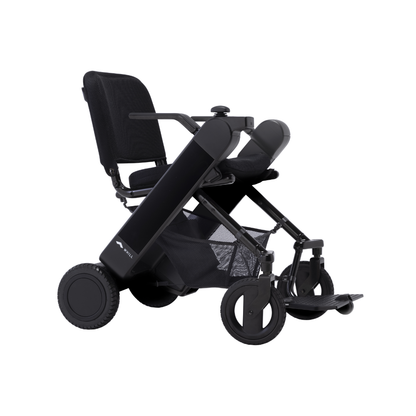 The Whill Model F Lightweight Portable Electric Wheelchair features a modern black design, mesh seat, wide armrests, large rear wheels, and small front wheels. See full specs and warranty details in the downloads section.