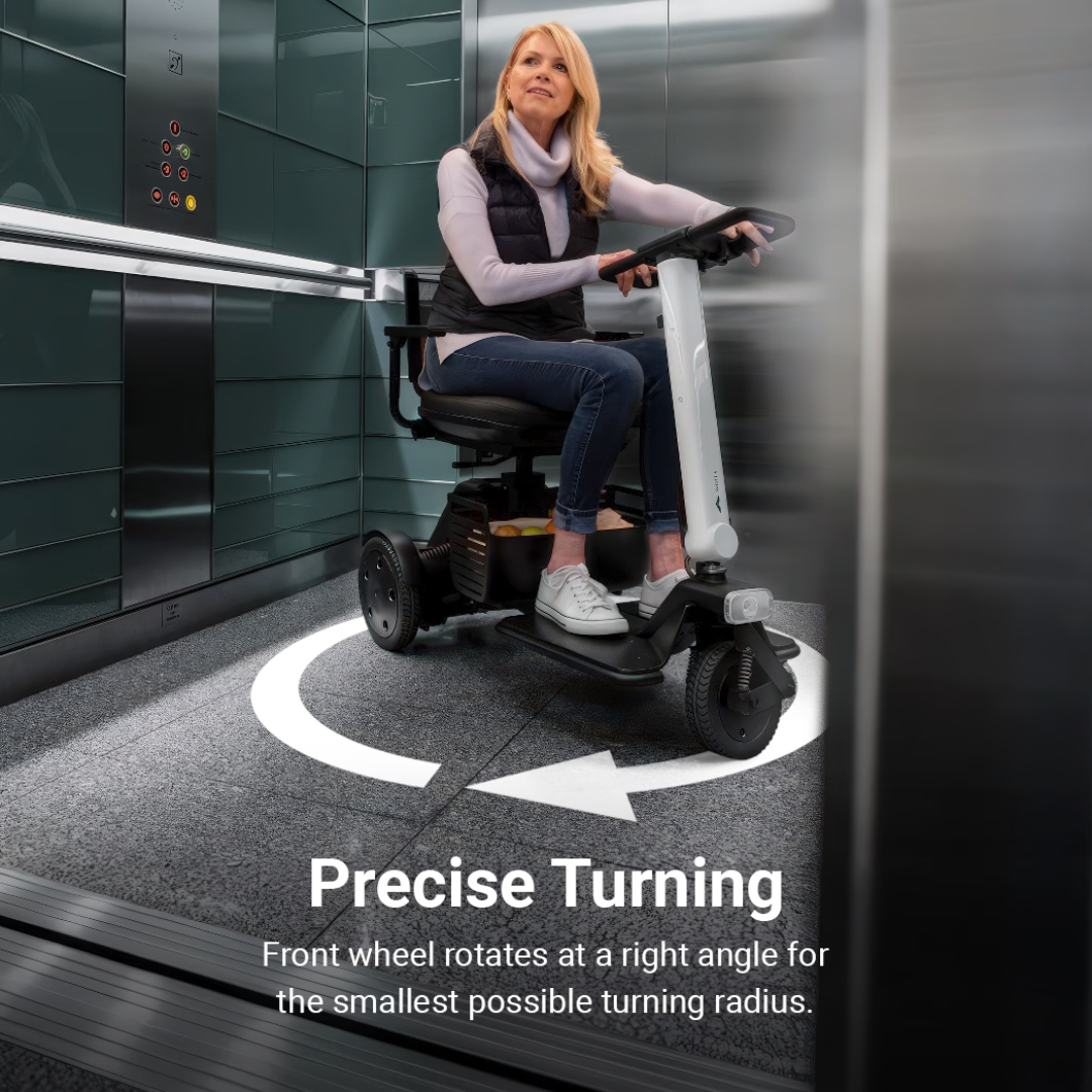 A woman in a Whill Model R 3-Wheel Mobility Scooter shows precise turning inside a modern elevator, following a white arrow on the floor. Text reads: Precise Turning—the front wheel rotates at a right angle for easy maneuvering.