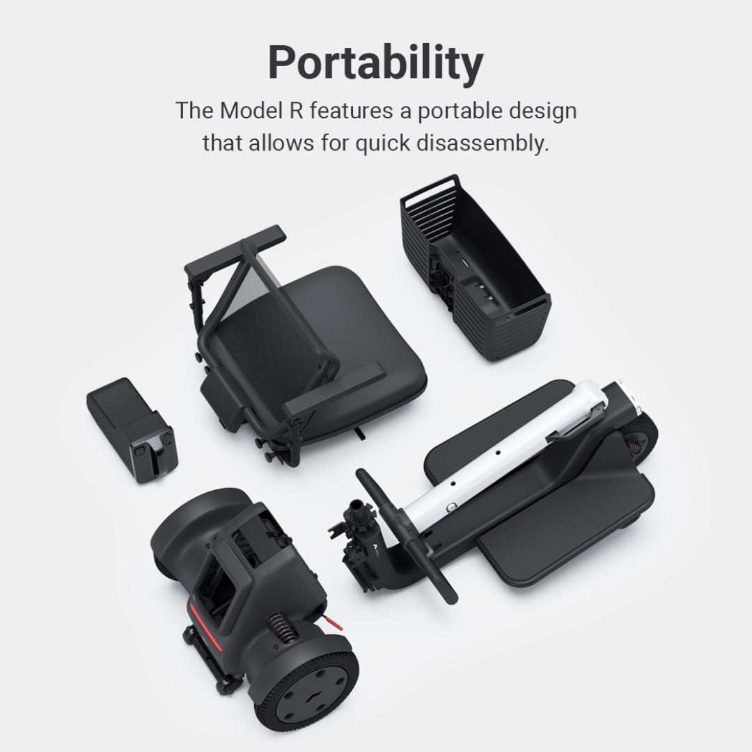 Five black components of the Whill Model R 3-Wheel Mobility Scooter are neatly arranged on a light background, showcasing its portable design and easy disassembly for convenient transport and storage.