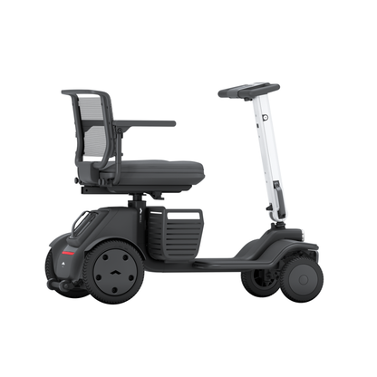 The Whill Model R 4 Wheel Portable Scooter features a sleek design with a black seat, mesh backrest, armrests, and four wheels. Its high handlebar and sturdy base ensure stability and comfort for versatile indoor or outdoor use.