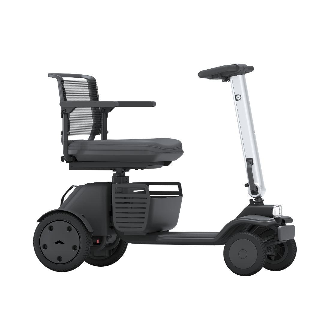 The Whill Model R 4 Wheel Portable Scooter, shown from the side on a white background, features a modern black design with a mesh backrest and armrests—blending comfort and style in a portable form.
