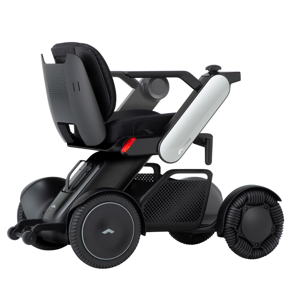 The Whill Model C2 Smart Power Chair is a compact, portable mobility device with a modern, ergonomic design, large wheels, padded seat with armrests, and sleek white side panels for sturdy support and user comfort.