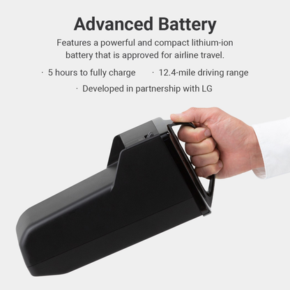 A hand holds the Whill Model F lightweight portable electric wheelchair battery: black, rectangular, powerful, compact, airline-approved, 5-hour charge, 12.4-mile range, developed with LG—specs and warranty details easily accessible.