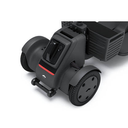Close-up of the Whill Model R 3-Wheel Mobility Scooter’s front wheel, showing its detailed tires, footrest, basket, and control panel with a red stripe and logo—perfect for dependable personal mobility needs.