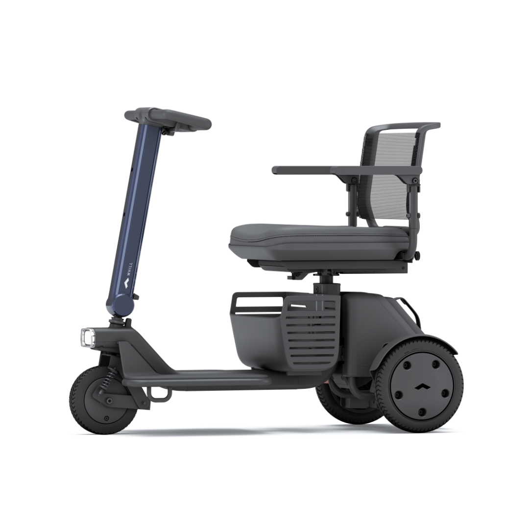 The Whill Model R 3-Wheel Mobility Scooter features a compact, ergonomic design with a mesh backrest, armrests, front headlight, and sleek dark gray finish—perfect for comfortable personal transportation.