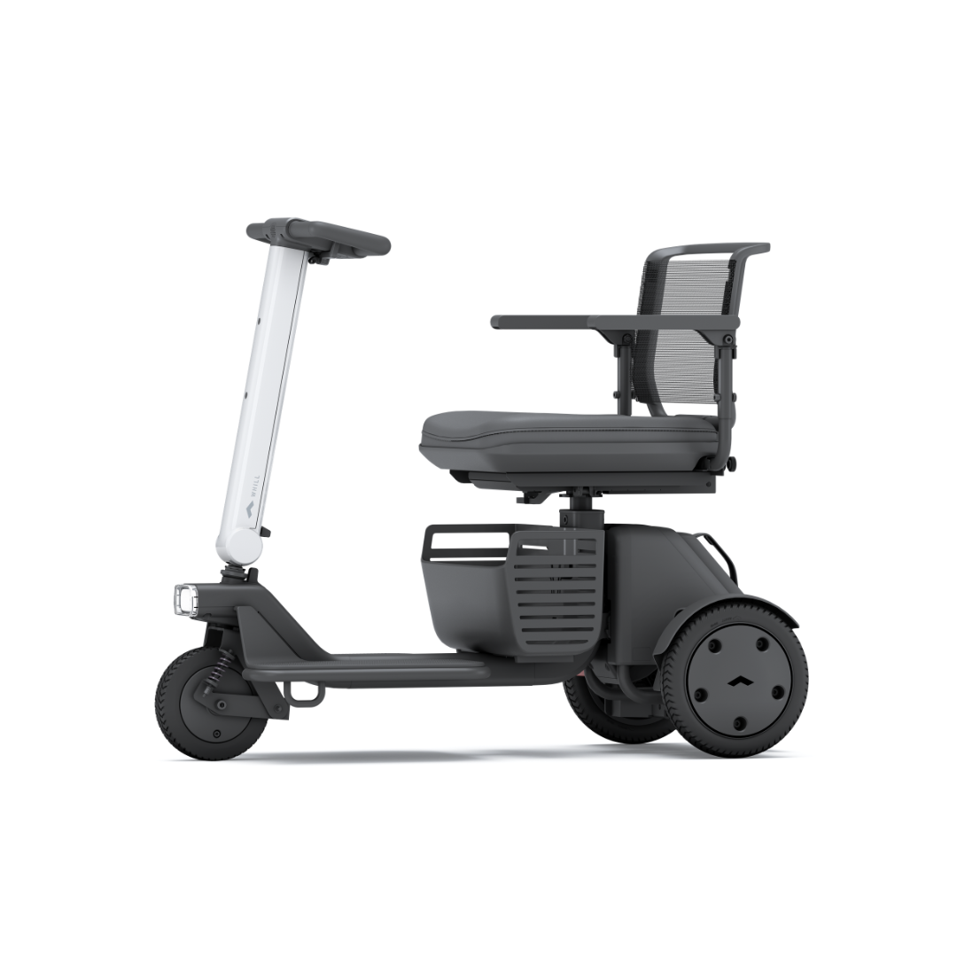 The Whill Model R 3-Wheel Mobility Scooter features a modern, compact design with a mesh backrest, armrests, and minimalist style in dark gray and white. Shown side-on against a white background for a sleek product presentation.