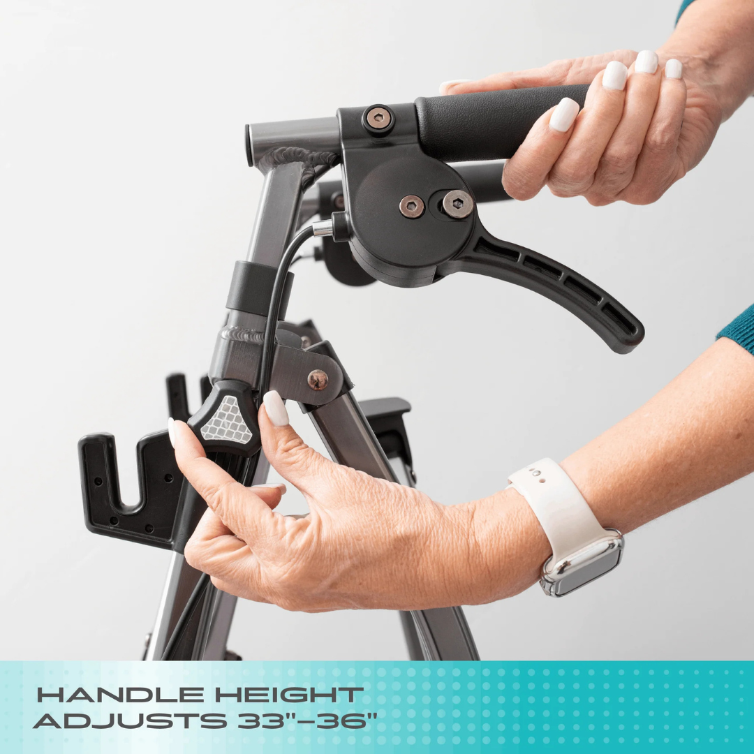 Close-up of a person adjusting the handle height of the Stander Wonder Indoor Rollator with Tray Table to between 33 and 36 inches. The individual is wearing a teal sleeve and a white wristwatch.