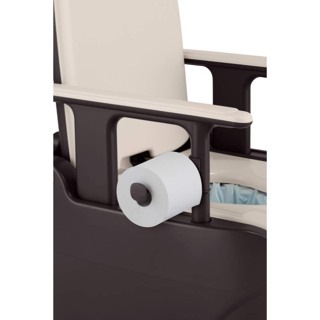 A close-up of the Wrappon® ORB - Portable Commode Toilet with Auto Waste Sealing, showing a toilet paper holder on the armrest with a mounted roll and a lined waste bucket beneath the seat.