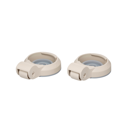 Two beige plastic caster wheels with round bases, likely spare parts for a Wrappon® ORB Portable Commode Toilet with Auto Waste Sealing, are shown side by side on a white background.