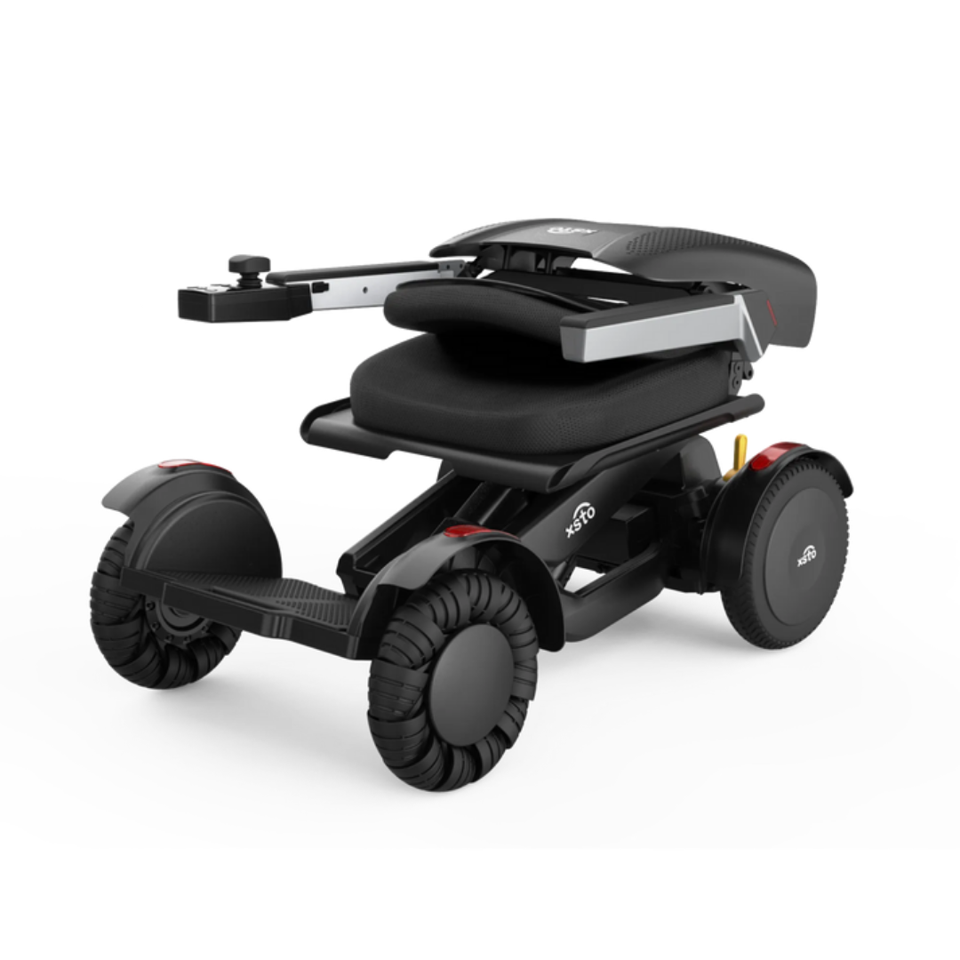 The XSTO Mobility M4 Self-Balancing Powerchair is a compact, lightweight foldable electric wheelchair with a black frame, cushioned seat, and four wheels for easy transport and storage.