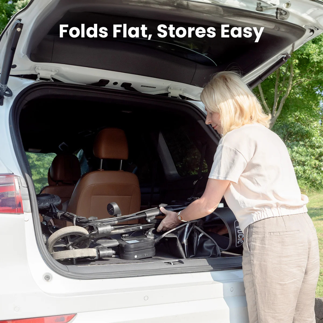 A person loads a folded Electric Rollator with Walk Assistance | VOCIC Z73 into the spacious trunk of a white SUV, with text above reading “Folds Flat, Stores Easy.” Trees and grass are visible in the background, emphasizing how this powered walking assist device fits seamlessly into your lifestyle.