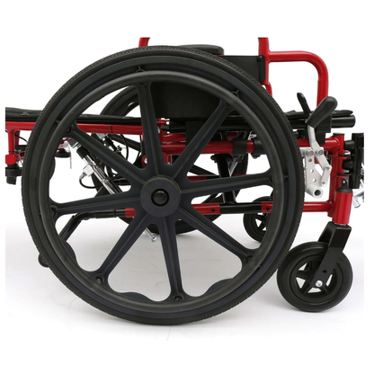 A close-up side view of the folded Circle Specialty ZIGGO Pro Reclining Pediatric Wheelchair in red, showing one large black wheel and a small front caster against a white background.