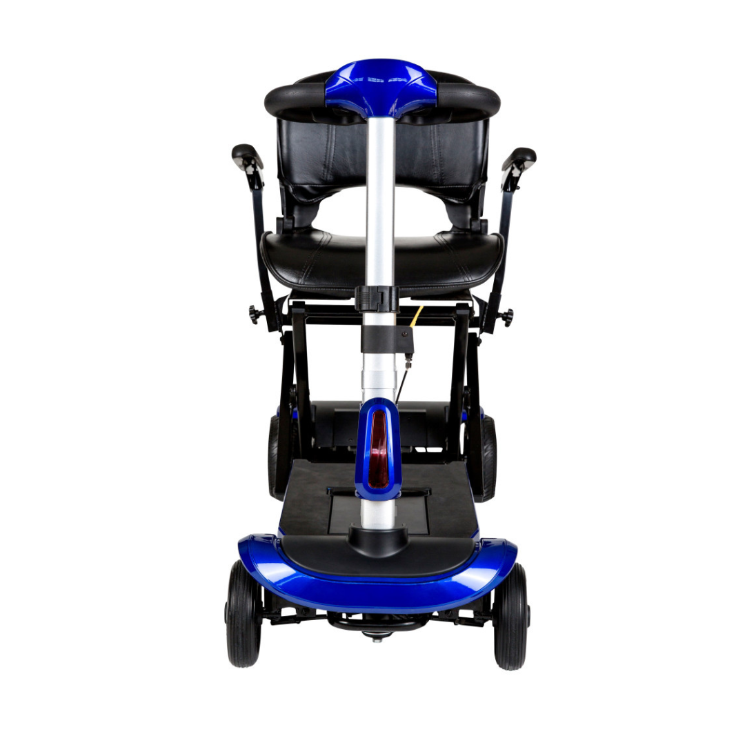 Front view of the Drive ZooMe Auto-Flex Folding Travel Scooter in blue, featuring a compact design, black padded seat with armrests, and four wheels, shown against a white background.