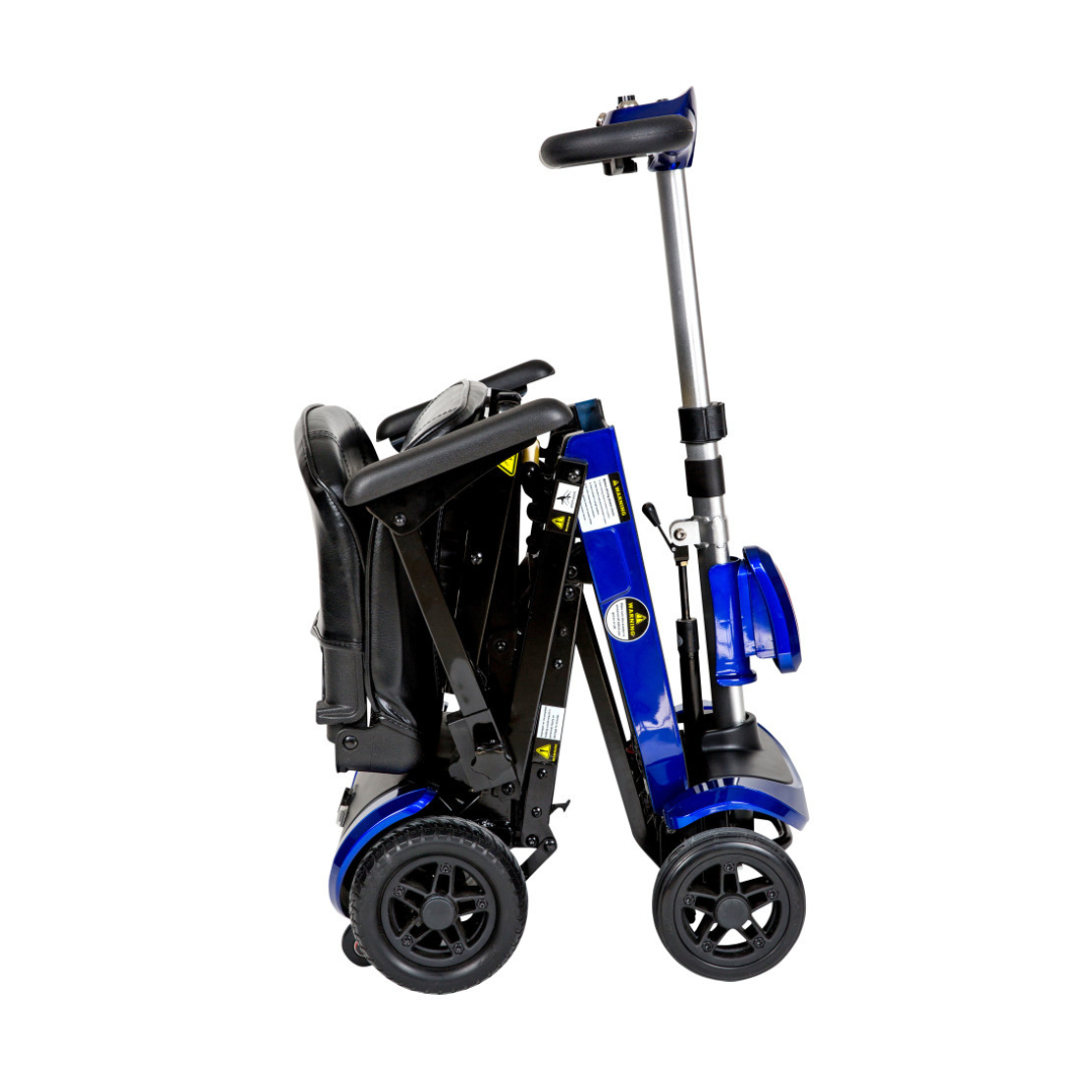 The Drive ZooMe Auto-Flex Folding Travel Scooter is a compact blue and black mobility scooter with four wheels and a telescoping handle, shown fully folded for easy transport.
