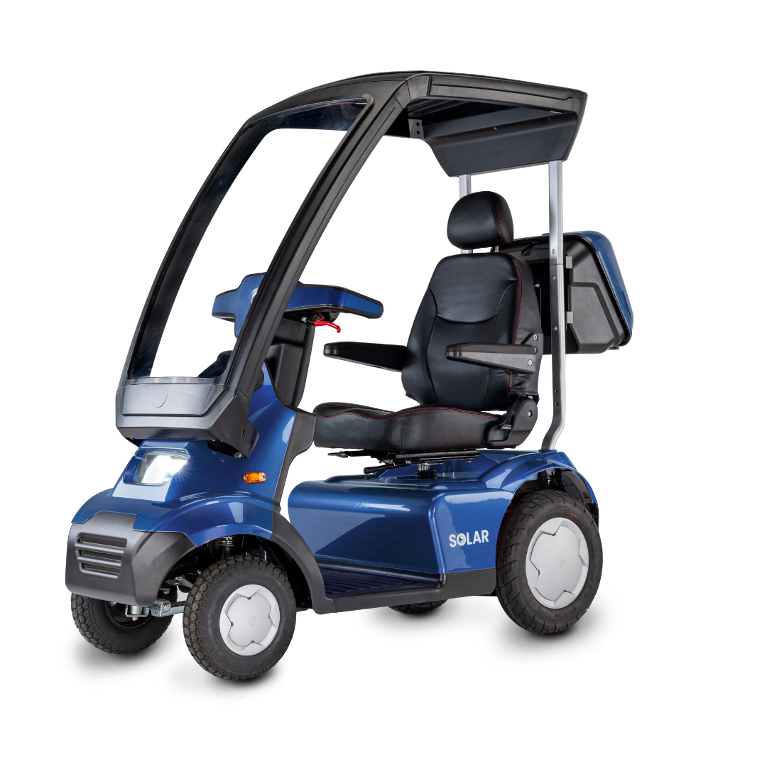 The Afikim Afiscooter Solar, a blue solar-powered bariatric mobility scooter with a transparent canopy, seat, and backrest, features four wheels and a Solar storage compartment. Its ergonomic tiller offers easy steering and impressive solar charging efficiency.
