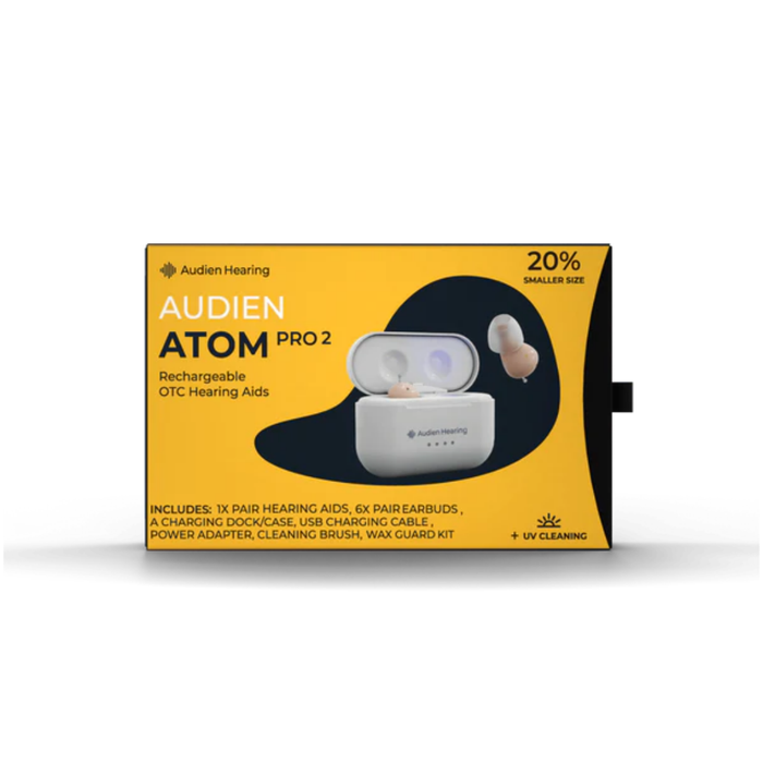 A yellow and black box of Audien Hearing Atom Pro 2 In-Ear OTC Hearing Aids displays the earbuds and charging case, highlighting rechargeability, advanced hearing modes, UV cleaning, and product details on the front.