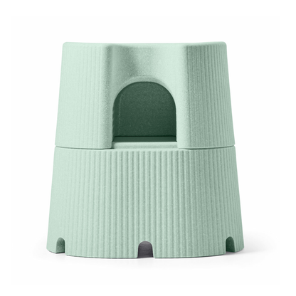 The byACRE DORICA Versatile Step Stool & Seat is a light green, cylindrical, stackable stool with a textured surface and arched center opening, offering water resistance and anti-slip features.