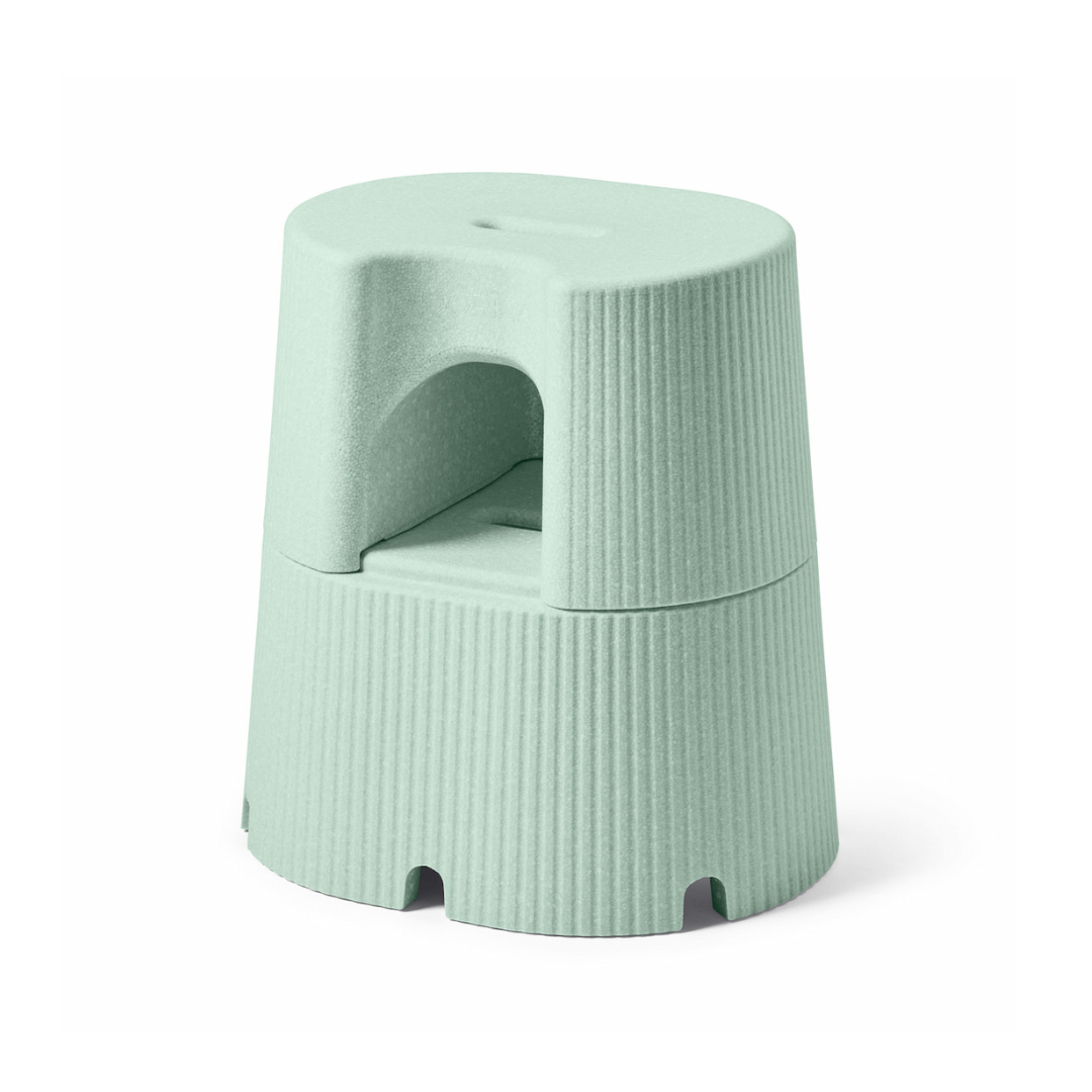 The byACRE DORICA is a light green, round, two-step stool and seat with a ribbed texture, handle cutout for easy carrying, water-resistant and anti-slip design—perfect for household use.