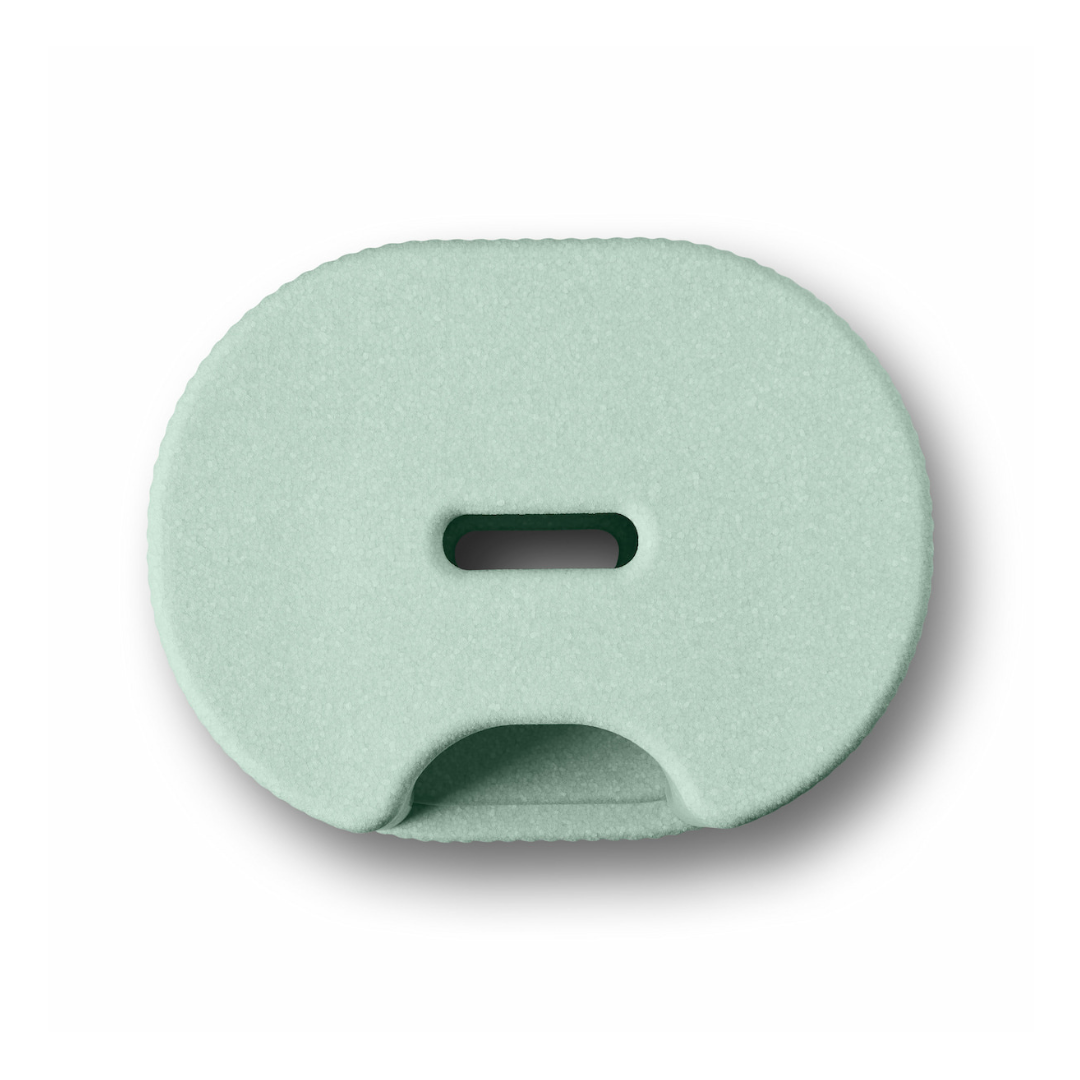 The byACRE DORICA Versatile Step Stool & Seat in mint green features an oval shape, a central horizontal slot, and a semicircular bottom opening—water-resistant and anti-slip, perfect for any space.
