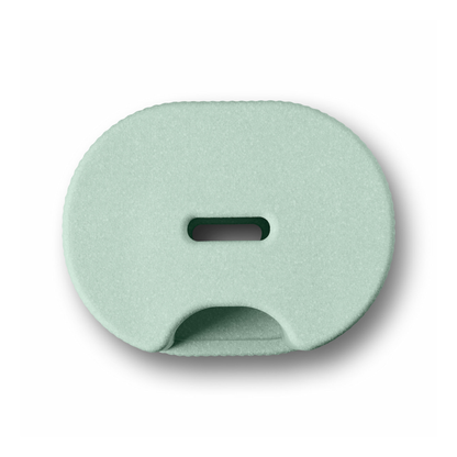 The byACRE DORICA Versatile Step Stool & Seat in mint green features an oval shape, a central horizontal slot, and a semicircular bottom opening—water-resistant and anti-slip, perfect for any space.