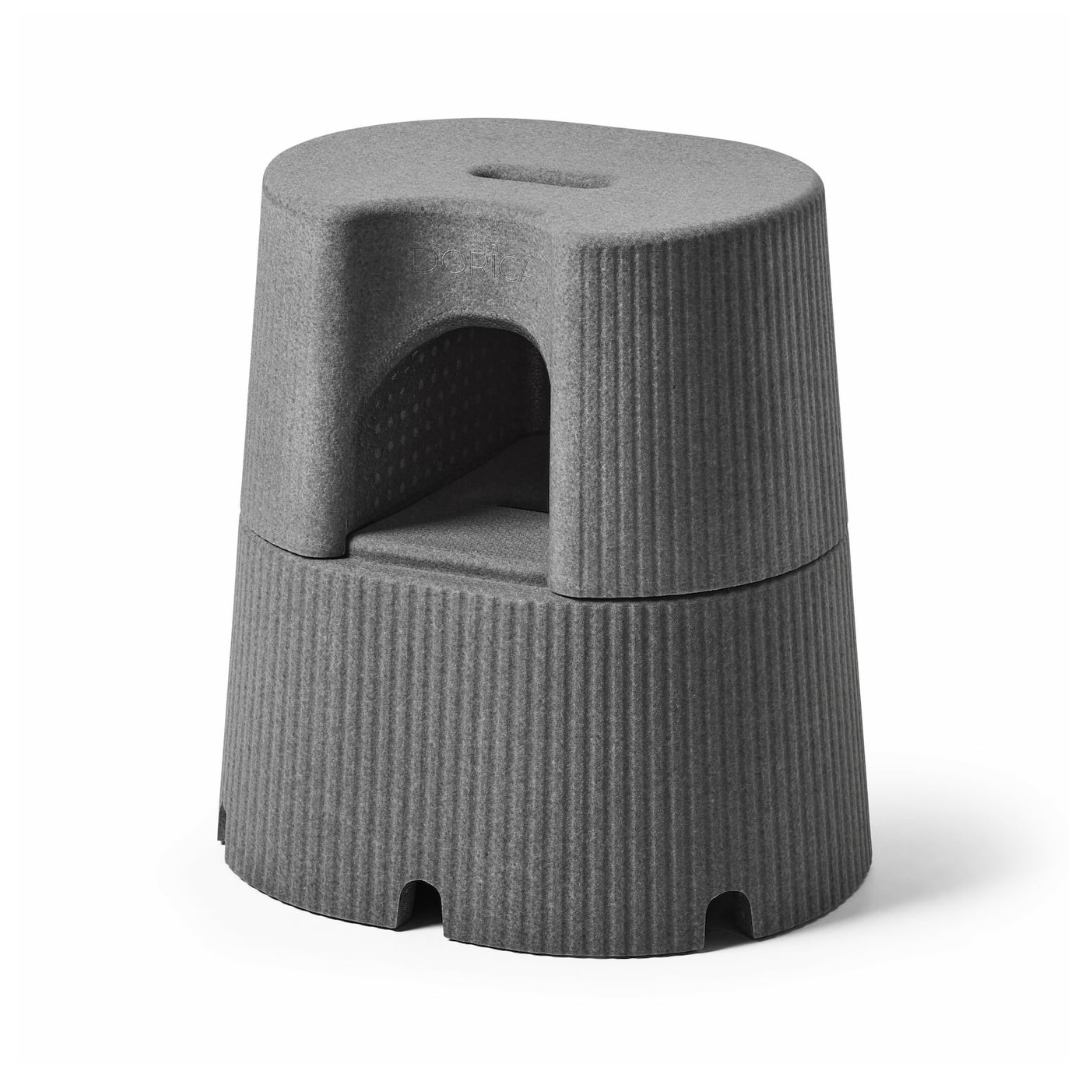The byACRE DORICA is a versatile, gray, round step stool and seat featuring a ribbed design, built-in top handle, cutout under the seat, and a modern minimalist look. It’s water-resistant, anti-slip, and made from lightweight material.