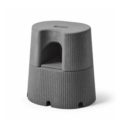 The byACRE DORICA Versatile Step Stool & Seat features a modern gray design, textured anti-slip surface, built-in handle, central cutout, and is water-resistant—ideal as both a step stool and an extra seat.