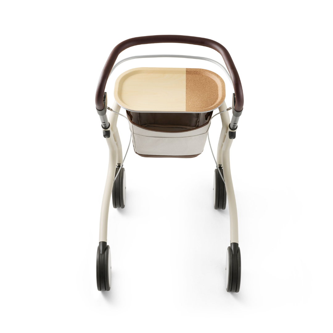 The byACRE Scandinavian Butler At-Home Rollator is a modern, lightweight four-wheel rollator with a brown and beige tray on top and storage beneath, shown from above against a white background.