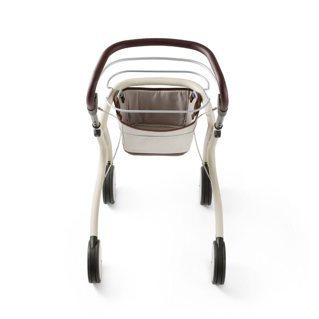 Overhead view of a modern, beige and brown byACRE Scandinavian Butler At-Home Rollator with a fabric basket and four black wheels, set against a white background.